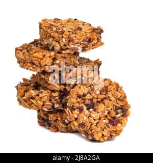 Turm von Cookies mit Honig Haferflocken Getreide auf dem weißen isoliert Stockfoto