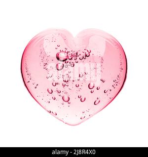Rosa serum Gel, Herzform Pfütze auf weißen Hintergrund isoliert, Ansicht von oben. Transparente care gel Gepressten mit Blasen close up, Makro auf Weiß isoliert Stockfoto