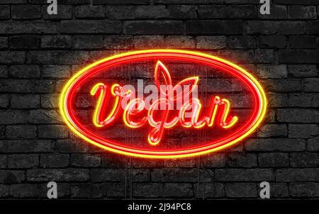 Vegane Neon Zeichen auf einem dunklen Backstein Hintergrund Stockfoto