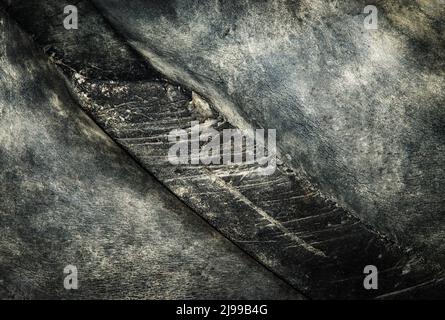 Abstrakter Hintergrund oder Texturdetail von alten gerissenen Gummireifen Stockfoto