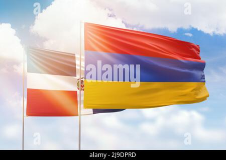 Sonniger blauer Himmel und Flaggen von armenien und der dominikanischen republik Stockfoto