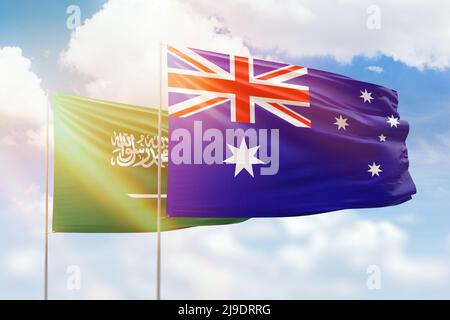 Sonniger blauer Himmel und Flaggen von australien und saudi-arabien Stockfoto