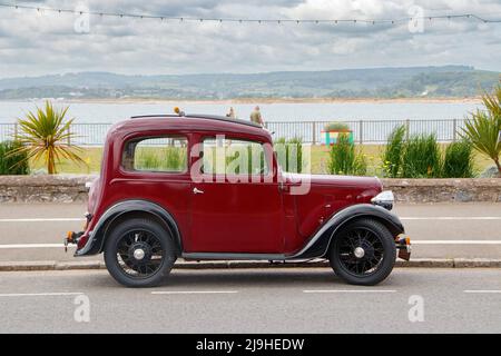 Seitenansicht des Jahrgangs 1930s kastanienbraun Austin Seven New Ruby in Exmouth Devon UK wird auch als Baby Austin bekannt Stockfoto