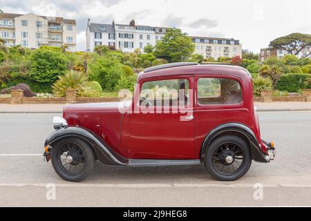 Seitenansicht des Jahrgangs 1930s kastanienbraun Austin Seven New Ruby in Exmouth Devon UK wird auch als Baby Austin bekannt Stockfoto