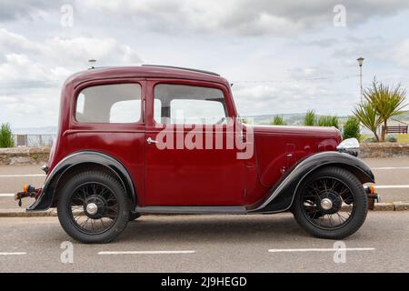 Seitenansicht des Jahrgangs 1930s kastanienbraun Austin Seven New Ruby in Exmouth Devon UK wird auch als Baby Austin bekannt Stockfoto