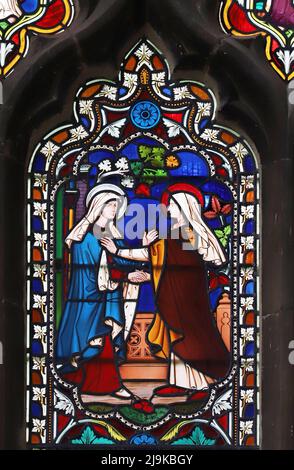 Ein Buntglasfenster von William Wailes, das die Visitation, die St. Peter and Paul Church, King's Sutton, Northamptonshire, darstellt Stockfoto
