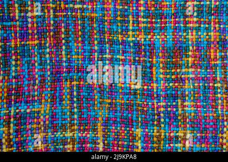 Nahaufnahme einer mehrfarbigen Struktur aus Wollstoff. Stockfoto