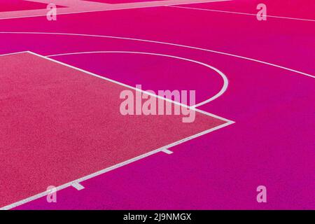 Rosa Basketballplatz Hintergrund. Draufsicht rosa Feld Gummi Boden mit weißer Linie im Freien Stockfoto