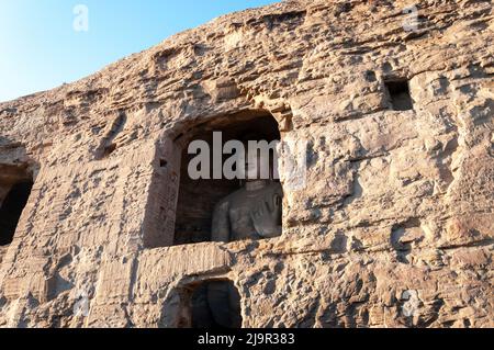 Buddha Statue geschnitzt in den Yungang Grotten in Datong, Shanxi, China Stockfoto