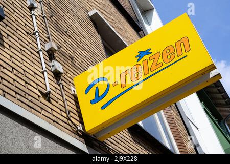 D-reizen-Schild am Reisebüro Stockfoto