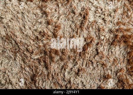 Brauner Stoffteppich mit langem Florstruktur Hintergrund Stockfoto