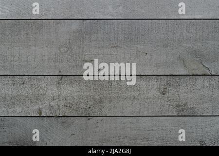 Struktur der Platten mit grauer Farbe lackiert. Verwitterte und raue Oberfläche von Wand-, Tisch- oder Zaunplatten, hohe Auflösung. Stockfoto