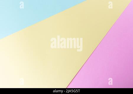 Pastellfarben Papierhintergrund mit blauer, gelber und violetter Textur Stockfoto