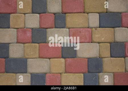 Farbige Pflasterfliesen in quadratischer Form. Draufsicht. Fußweg Stockfoto