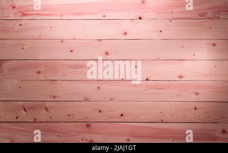 Die rosa Holzstruktur mit natürlichen Mustern. Kirschbaum Holz Hintergrund. Panoramafenster mit rosafarbenem Holzfußboden. Stockfoto