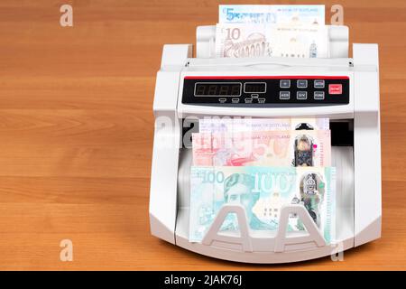 Scottish Money - Pfund in einer Zählmaschine Stockfoto
