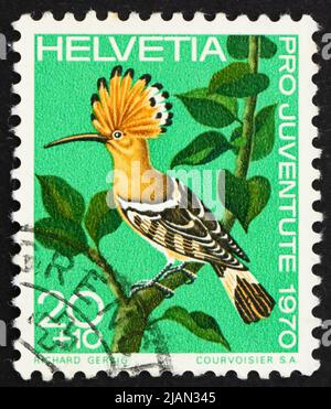 SCHWEIZ - UM 1970: Eine in der Schweiz gedruckte Briefmarke zeigt Hoopoe, Upupa Espops, Vogel, um 1970 Stockfoto