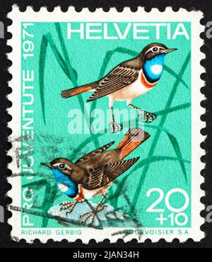 SCHWEIZ - UM 1971: Eine in der Schweiz gedruckte Briefmarke zeigt Weißfleckige Blaukehlchen, Luscinia svecica, Vogel, um 1971 Stockfoto