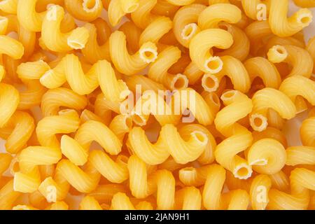 Cavatappi trockene Pasta Bio-Produkt Hintergrund gelb Stockfoto