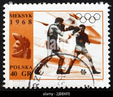 POLEN - UM 1968: Eine in Polen gedruckte Briefmarke zeigt Boxen, olympische Sommersportarten, Mexiko 68, um 1968 Stockfoto