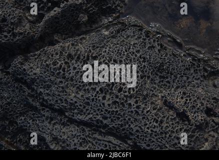 Vulkanisches Gestein rund um das Kap Punta de las Arenas im Westen von Gran Canaria, auch Playa de Artenara genannt Stockfoto