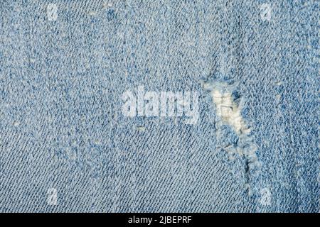 Alte blaue Denim Jeans-Textur. Jeans mit kratzenden Denim-Jeans. Jeans in Blau. Stockfoto