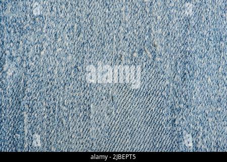 Alte blaue Denim Jeans-Textur. Jeans mit kratzenden Denim-Jeans. Jeans in Blau. Stockfoto