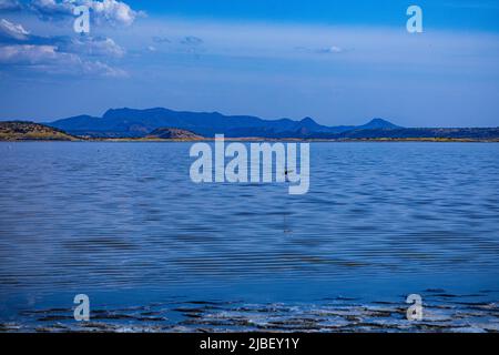 Der Magadi-See ist der südlichste See im Kenia Rift Valley und liegt in einem Einzugsgebiet von vulkanischen Felsen nördlich von Tansania Stockfoto