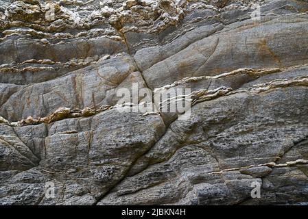 Rock-Textur mit verschiedenen Beulen und Farben. Stockfoto