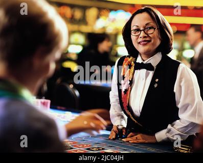 Frau-Händler in casino Stockfoto