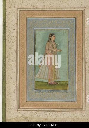 Eine Frau wird im Profil angezeigt. Sie hält einen Zweig Narzissen in ihrer rechten Hand. Sie trägt eine transparente Robe über ihrer orangefarbenen Hose und eine goldfarbene und rot gestickte Schärpe um ihre Taille. Der Hintergrund ist schlicht hellgrün, Portrait of a Lady., Zeichner: Anonym, Indien, c. 1635 - c. 1645, Papier, Pinsel, H 126 mm × B 69 mm, H 290 mm × B 208 mm Stockfoto