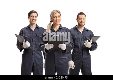 Weibliche und zwei männliche Arbeiter in Uniformen auf weißem Hintergrund isoliert Stockfoto