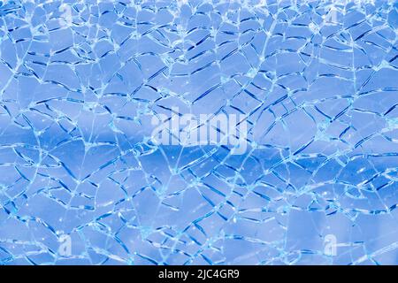 Zerbrochene Glas mit Rissen als Hintergrund Stockfoto
