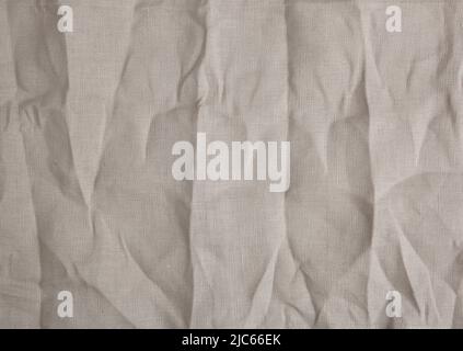 Brauner brauner Stoffhintergrund. Leinwandtapete. Leerer Stoffhintergrund. Zerknitterte Textur. Stockfoto
