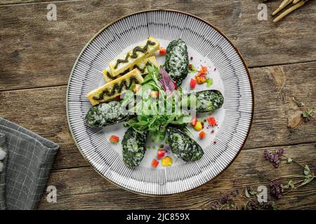 Portion gefüllte Gourmet-Muscheln Stockfoto