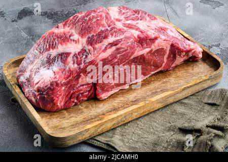 Rohes frisches Fleisch Ribeye-Steak Encote von Black Angus Prime Fleisch, auf grauem Steinhintergrund Stockfoto