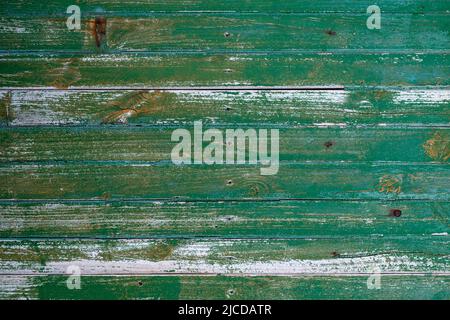 Alte grün bemalte verzweifelte Holzbohlen Wand, grunge rustikalen Hintergrund Stockfoto