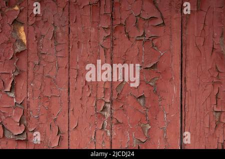 Grunge Hintergrund: Abgestreifte alte Bretter mit roter Farbe bemalt Stockfoto