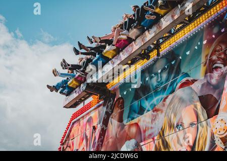 Jiminy Cricket Fair Ride am Morpeth Fair Day, 2022. Juni, Northumberland Stockfoto