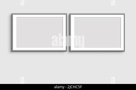 Zwei horizontale graue Rahmen an einer hellgrauen Wand. Nachbau von Posterrahmen. Kunstausstellung. Ein minimalistisches Modell. Stockfoto
