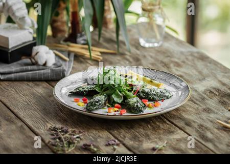 Portion gefüllte Gourmet-Muscheln Stockfoto