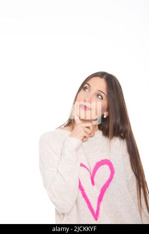 Spanische Frau träumt vor weißem Hintergrund - Stock Foto Stockfoto