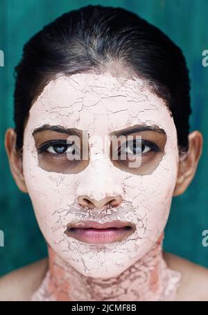 A young woman with a Pink Clay Face Mask. Stockfoto