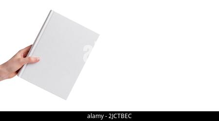 Weißes Buch Nachbildung in der Hand isoliert auf weißem Hintergrund. Banner mit Literaturmockup und Platz für Text. Hochwertige Fotos Stockfoto
