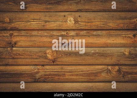 Brauner Holzhintergrund aus natürlichem Baum. Die Holzplatte hat ein wunderschönes dunkles Muster, Holzfußböden. Vintage rustikale horizontale Planke Stockfoto