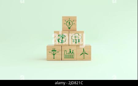 Alternative Energien, um den Planeten zu retten. Ökologische Symbole für den CO2-Fußabdruck auf einem Holzwürfel. Konzept der niedrigen CO2-Emissionen. 3D Rendern. Stockfoto