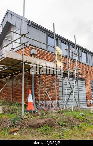 Woodbridge Suffolk UK February 20 2022: Eine alte Scheune und Ställe, die sich mitten in der Umwandlung in ein modernes Familienhaus befinden Stockfoto