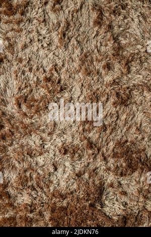 Brauner Stoffteppich mit langem Florstruktur Hintergrund Stockfoto