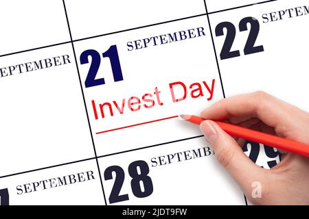 21. Tage im September. Hand zeichnen rote Linie und schreiben Sie den Text Invest Day am Kalenderdatum 21. September. Geschäfts- und Finanzkonzept. Herbstmons Stockfoto