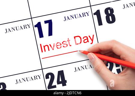 17. Tage im Januar. Hand zeichnen rote Linie und schreiben Sie den Text Invest Day am Kalenderdatum Januar 17. Geschäfts- und Finanzkonzept. Wintermonat, Stockfoto